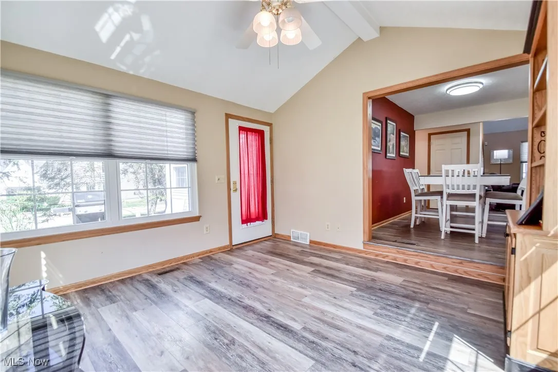 Entrance foyer with light wood-style flooring and ceiling fan