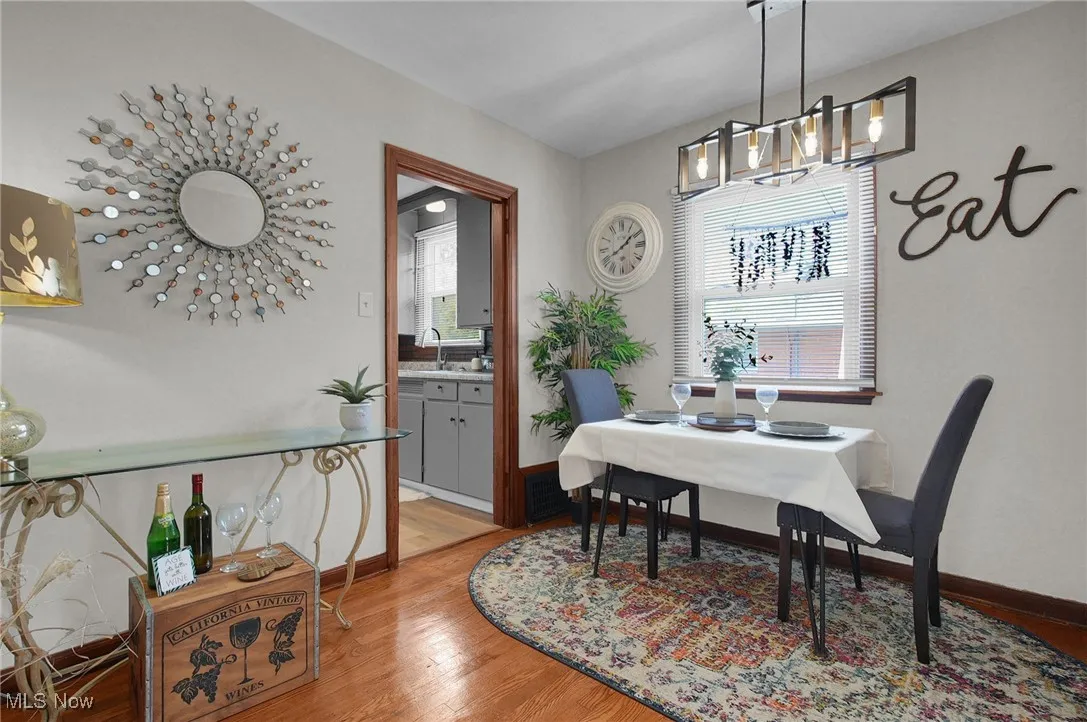 Dining space with light wood-type flooring and baseboards