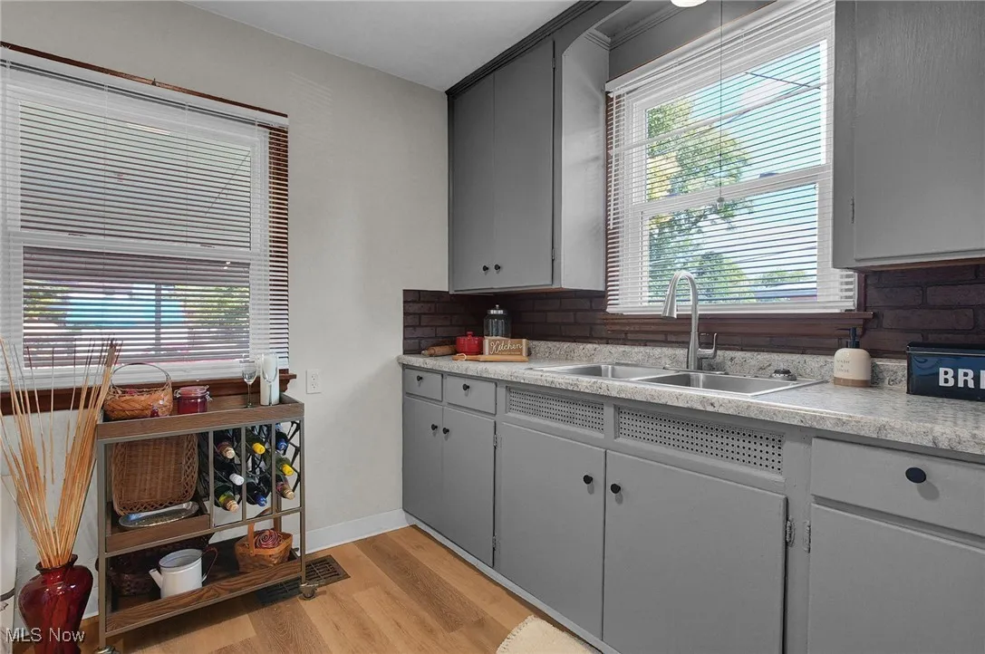 Kitchen with light countertops, plenty of natural light, and light wood-style flooring
