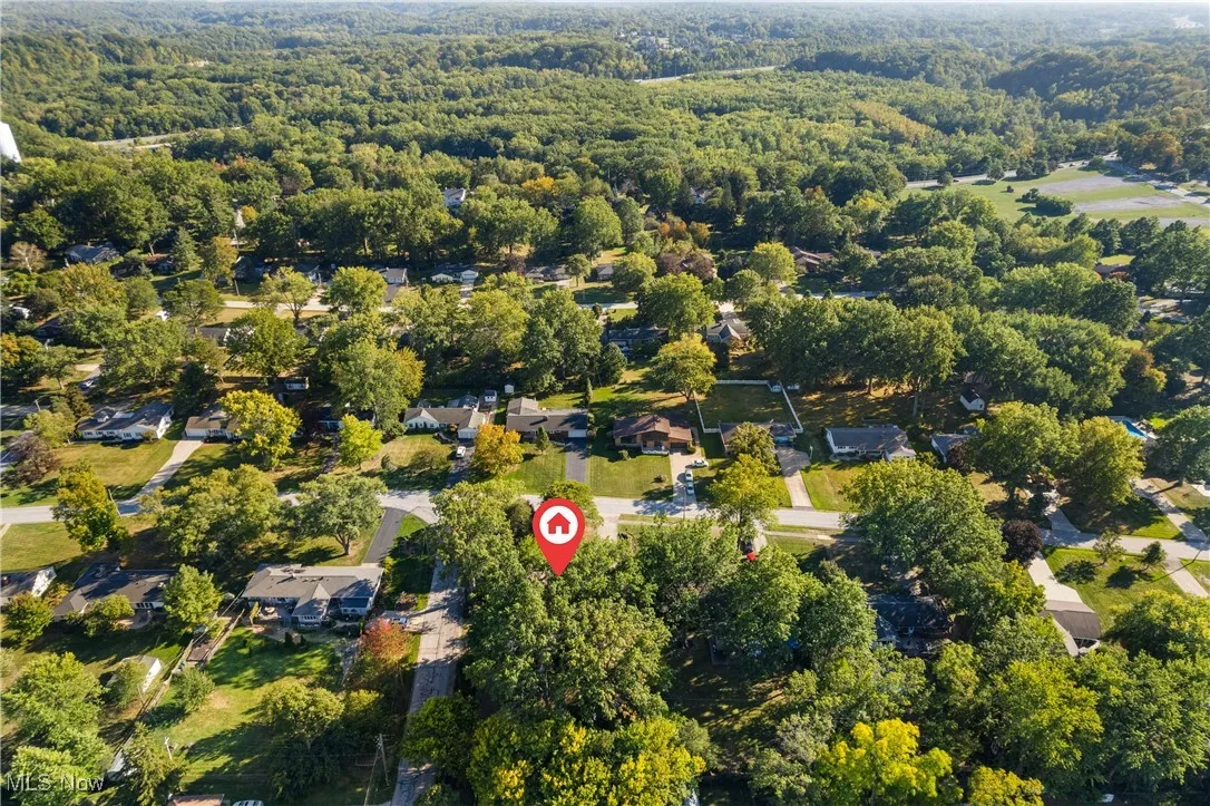 Aerial overview of property's location featuring nearby suburban area