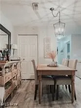 Dining space with light wood-style flooring