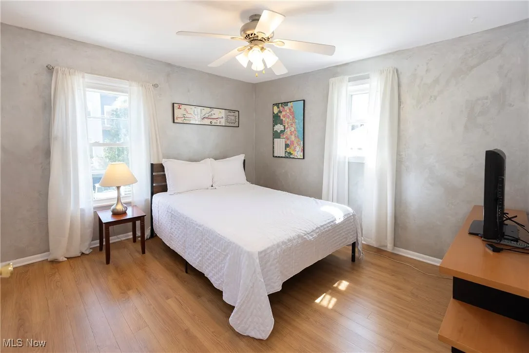 Primary Bedroom with two windows and window treatments!