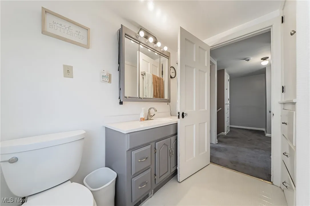 Bathroom featuring vanity and toilet