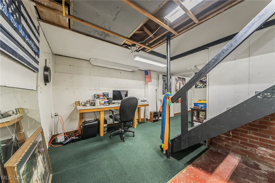 Below grade area with an office area