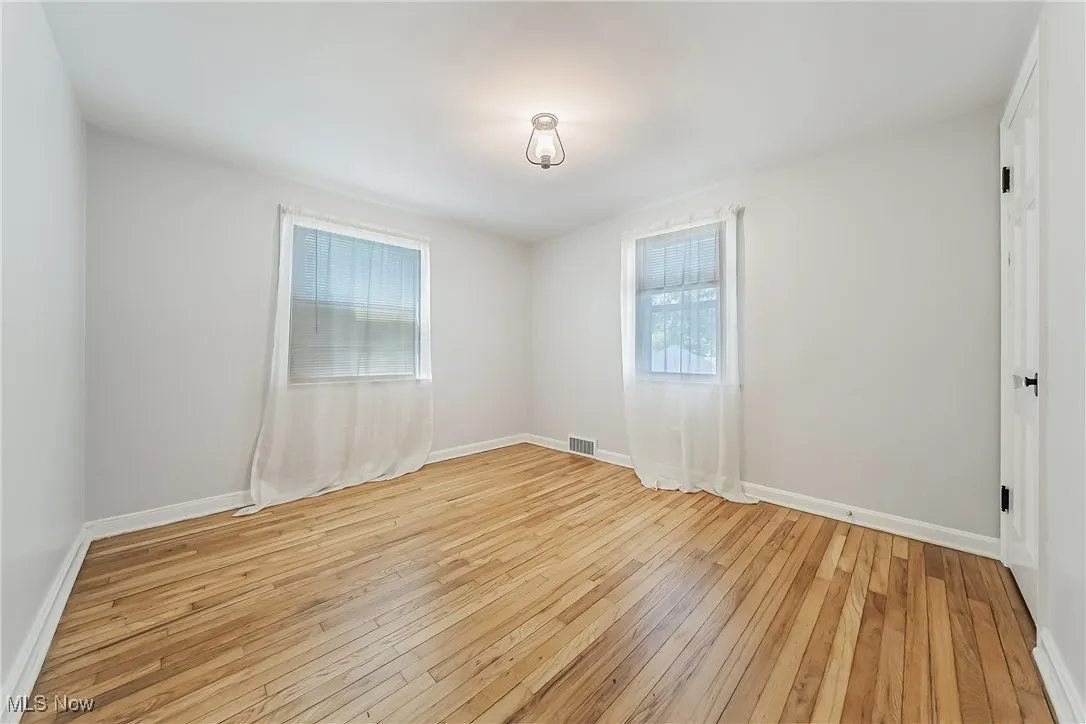 Empty room featuring light wood-style flooring