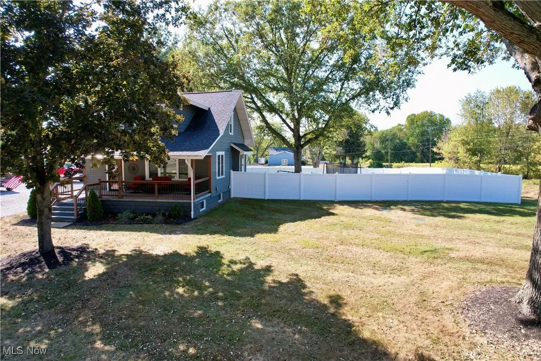 View of yard featuring covered porch