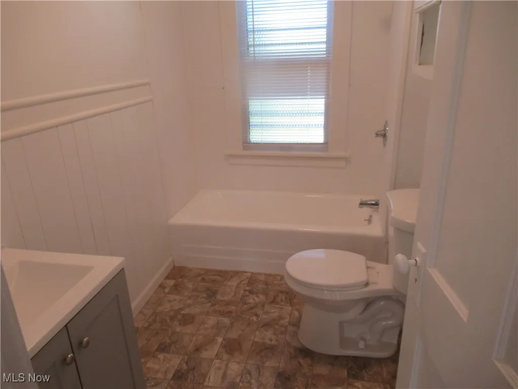 Full bathroom with vanity and  shower combination