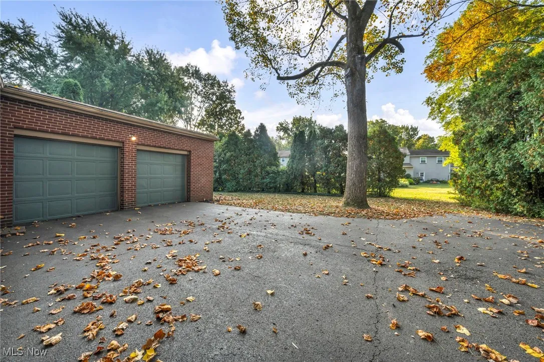 Garage featuring driveway