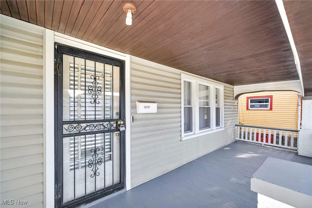 Property entrance with covered porch