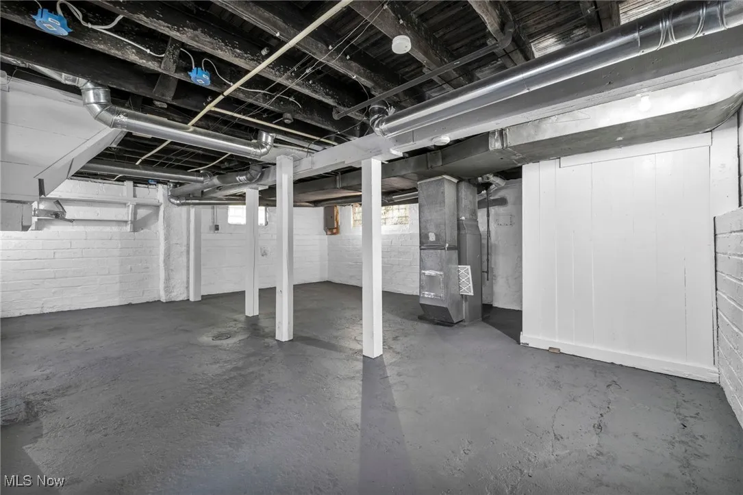 Below grade area featuring heating unit