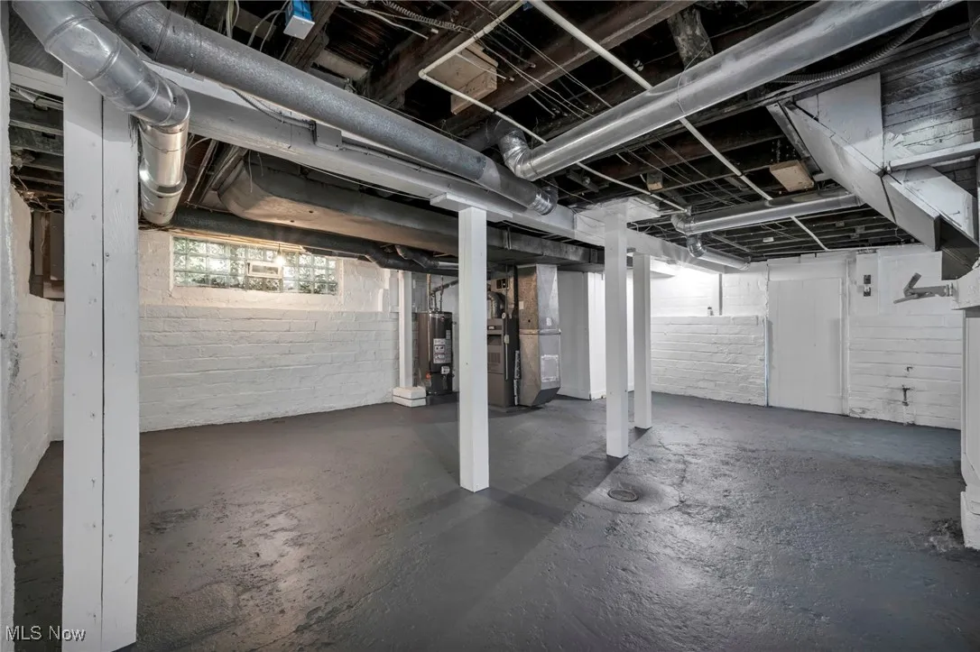 Basement with heating unit and gas water heater