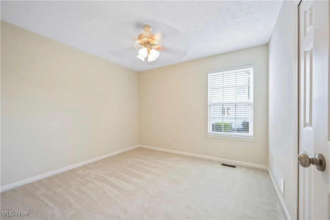 2nd Bedroom featuring ceiling fan, window and closed