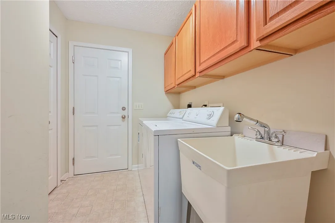 First floor laundry/mudroom entry thru garage with cabinet space, and independent washer and dryer
