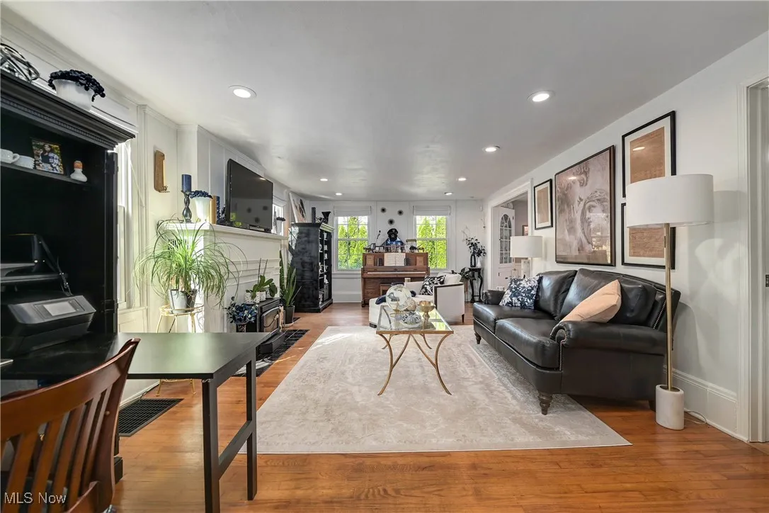 Living area featuring wood finished floors and recessed lighting