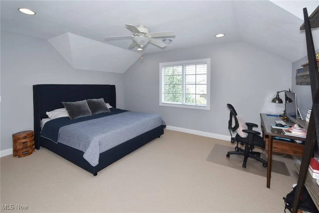 Bedroom featuring recessed lighting, lofted ceiling, carpet floors, a ceiling fan, and an office area
