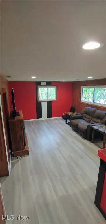 Living area with light wood-style flooring