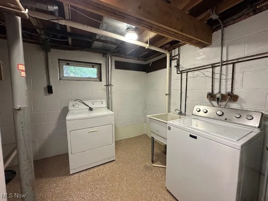 Washroom featuring separate washer and dryer