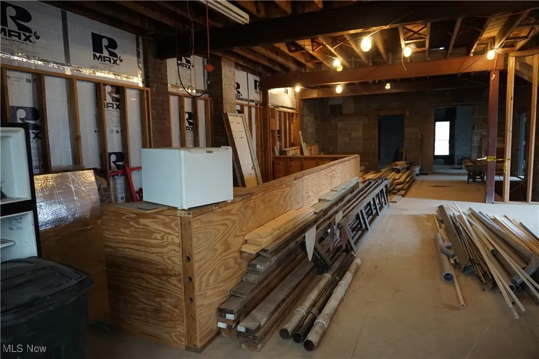 Below grade area with white fridge