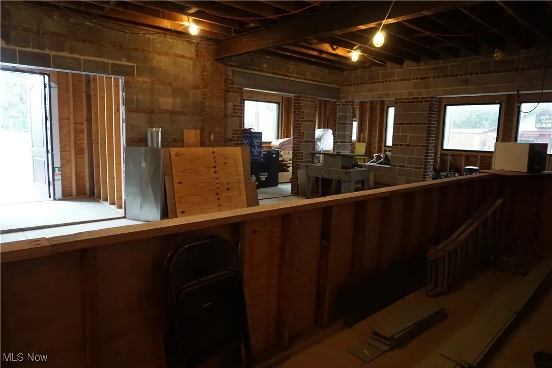 Miscellaneous room featuring healthy amount of natural light and an upstairs landing