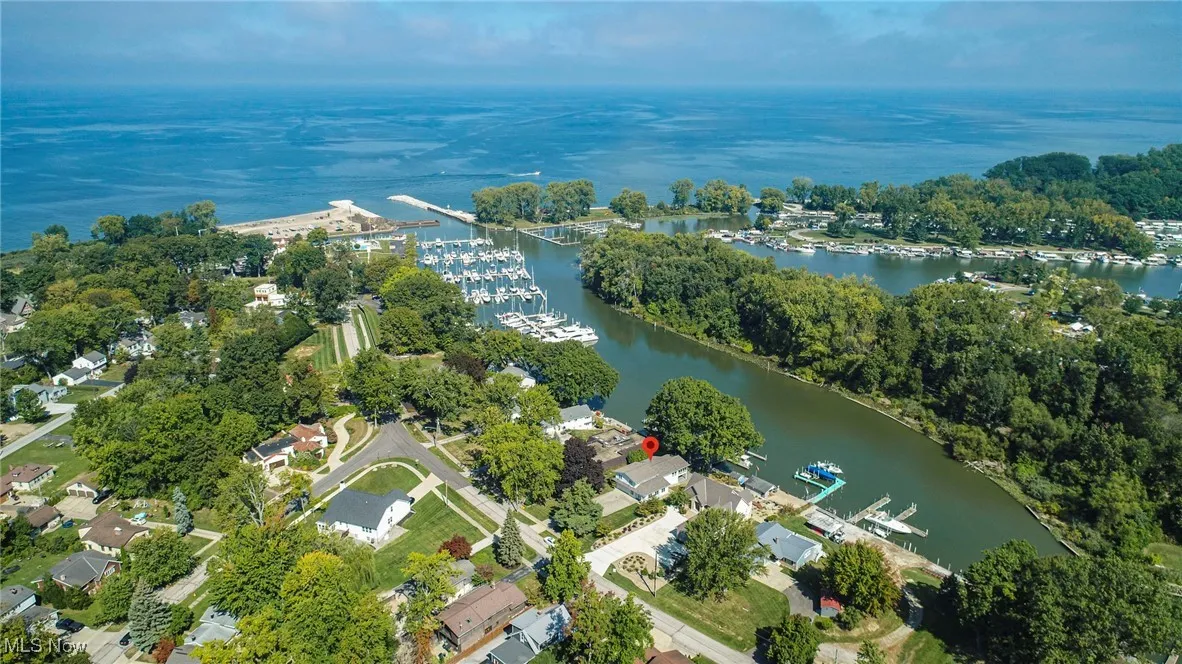 Aerial view of property and surrounding area featuring Mentor Harbor Yacht Club and Lake Erie