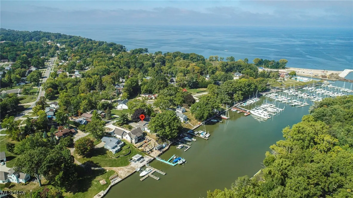 Aerial view of property and surrounding area featuring Lake Erie and MHYC