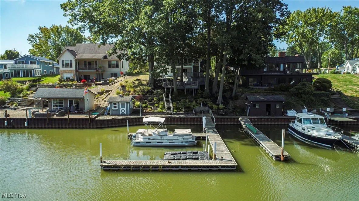 Dock featuring a water view and a residential view