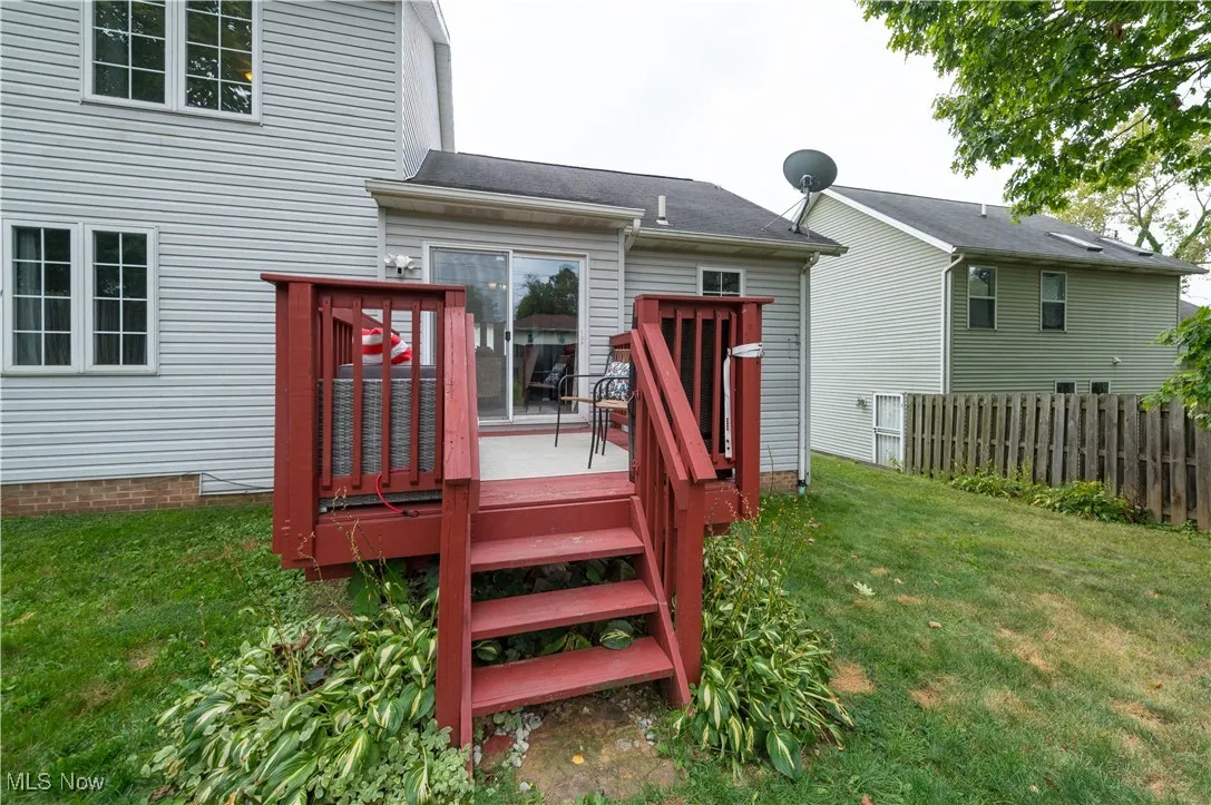 Rear view of house featuring a deck