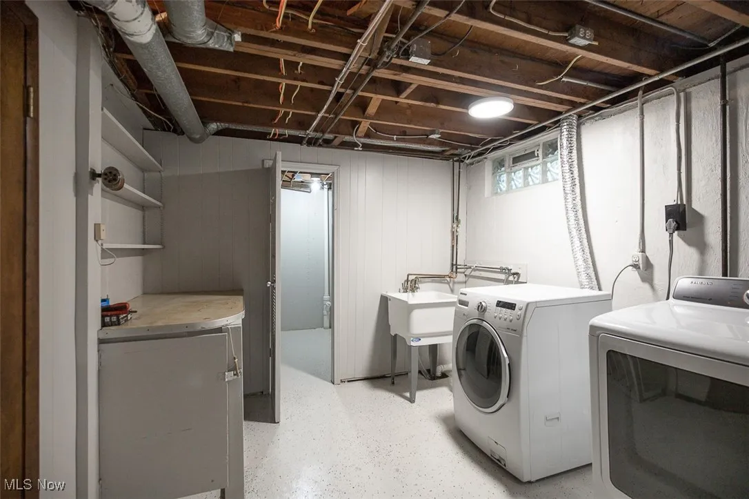 Laundry area featuring washing machine and clothes dryer