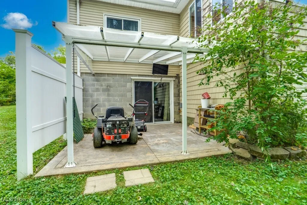 Rear view of house featuring a patio area