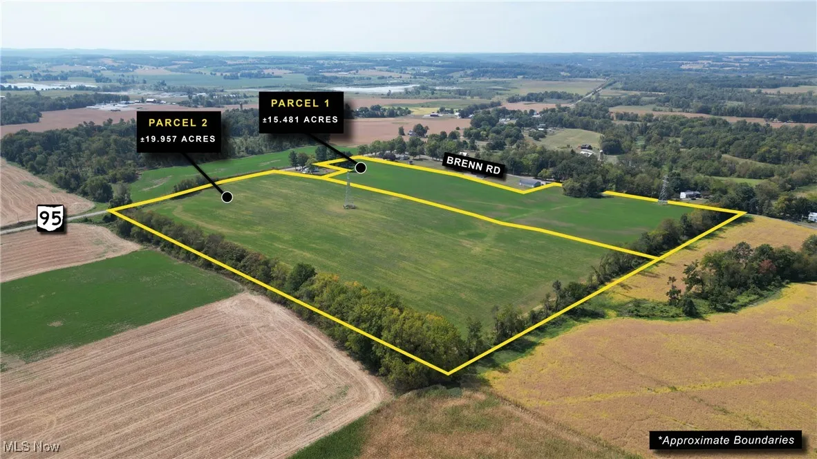 Aerial view of sparsely populated area featuring property parcel outlined