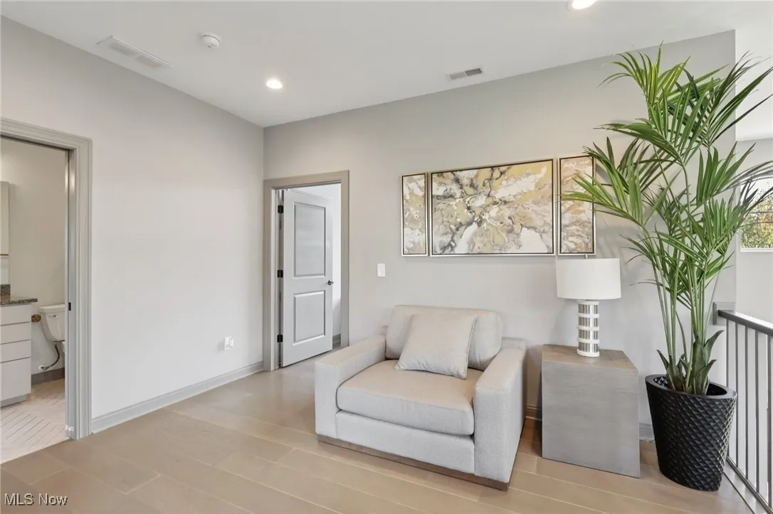 Sitting room featuring recessed lighting and light wood-style floors