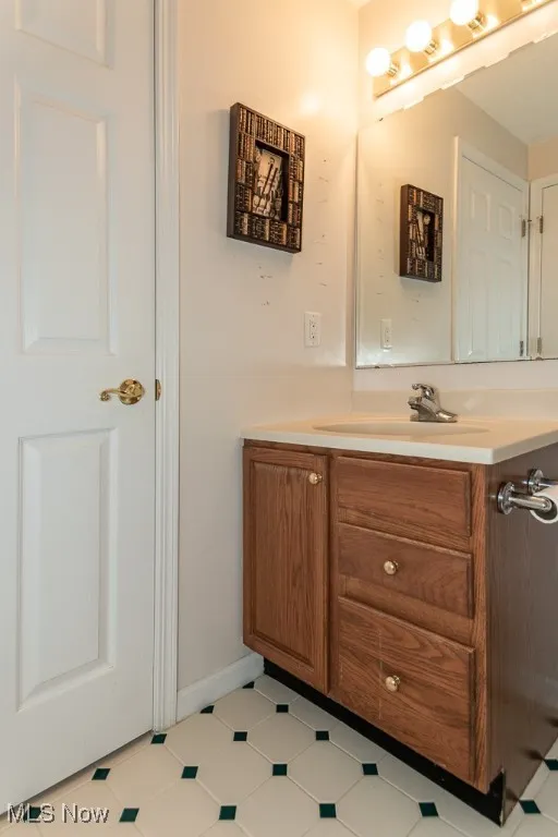 Bathroom featuring vanity and baseboards