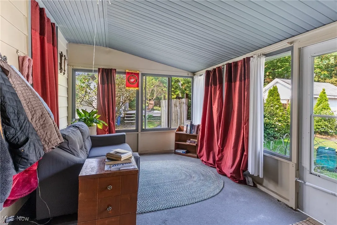 Sunroom with vaulted ceiling