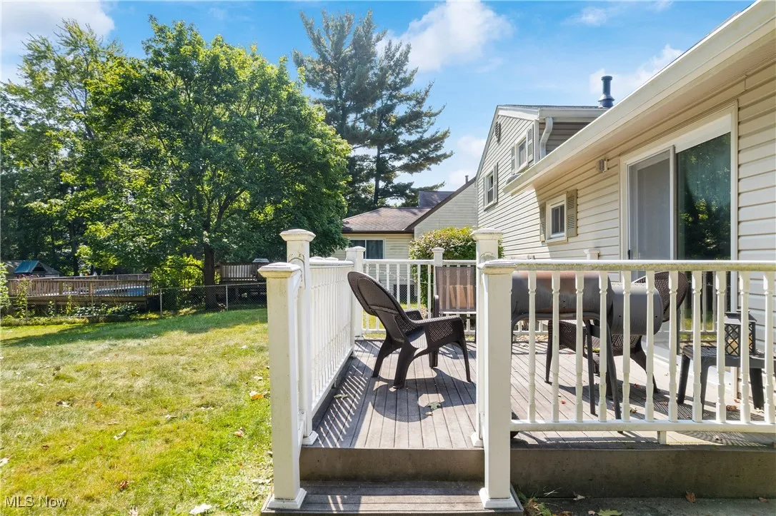 View of wooden deck with railings.