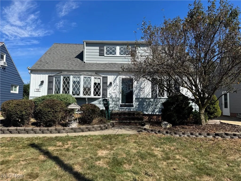 View of front of property and lawn