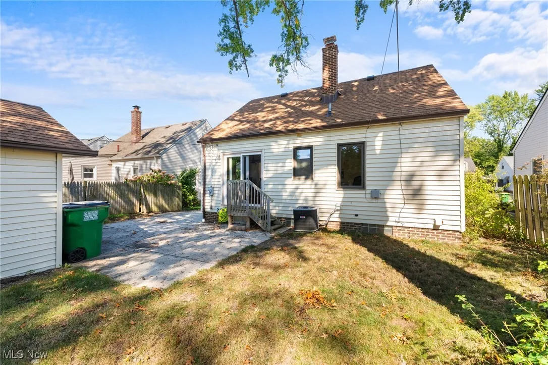 Rear view of property with a patio and a chimney