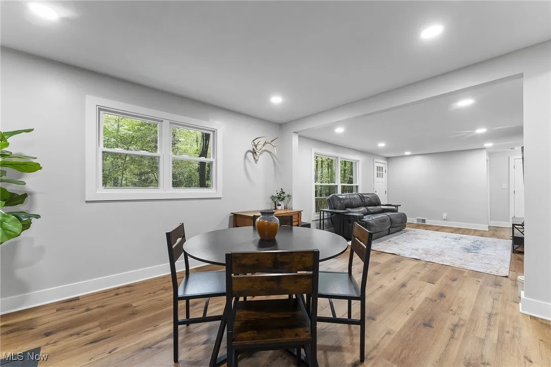 Additional view of the dining area featuring views of the outdoors