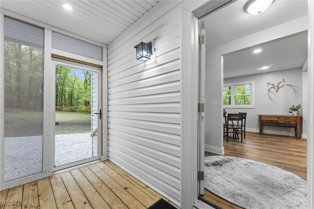 Enclosed wooden deck with views of the outdoors