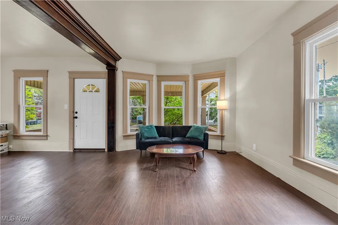 Sitting room with wood finished floors and baseboards