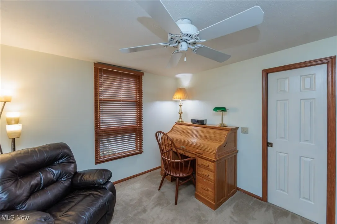 Private office with double doors, connected to a full bath.