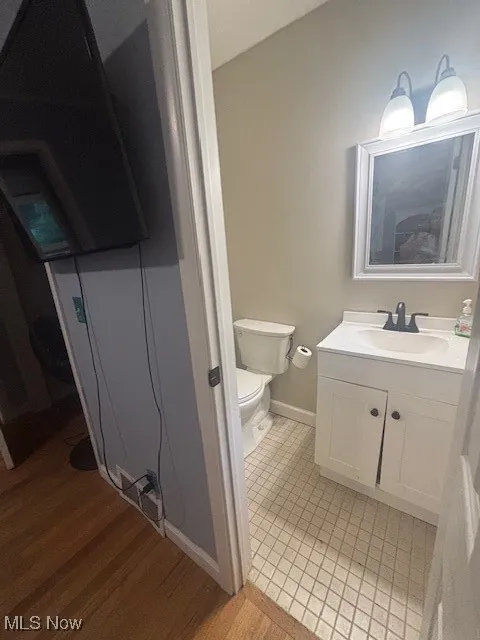 Bathroom with vanity and light wood-style floors