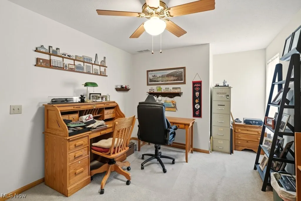 Office featuring light carpet and a ceiling fan