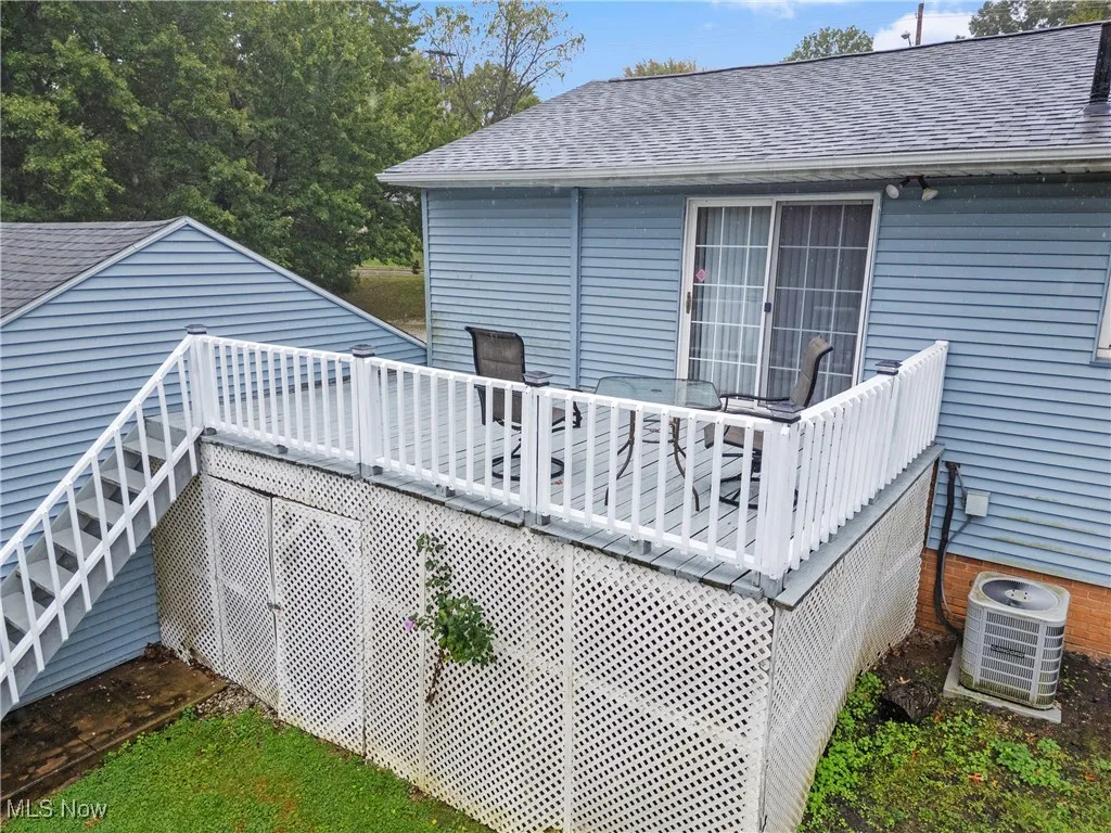 Wooden terrace featuring stairway