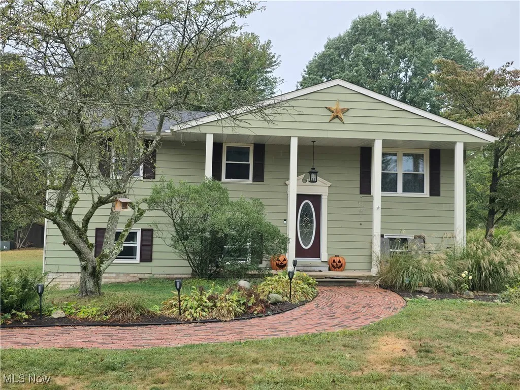 Front view of home with landscaping