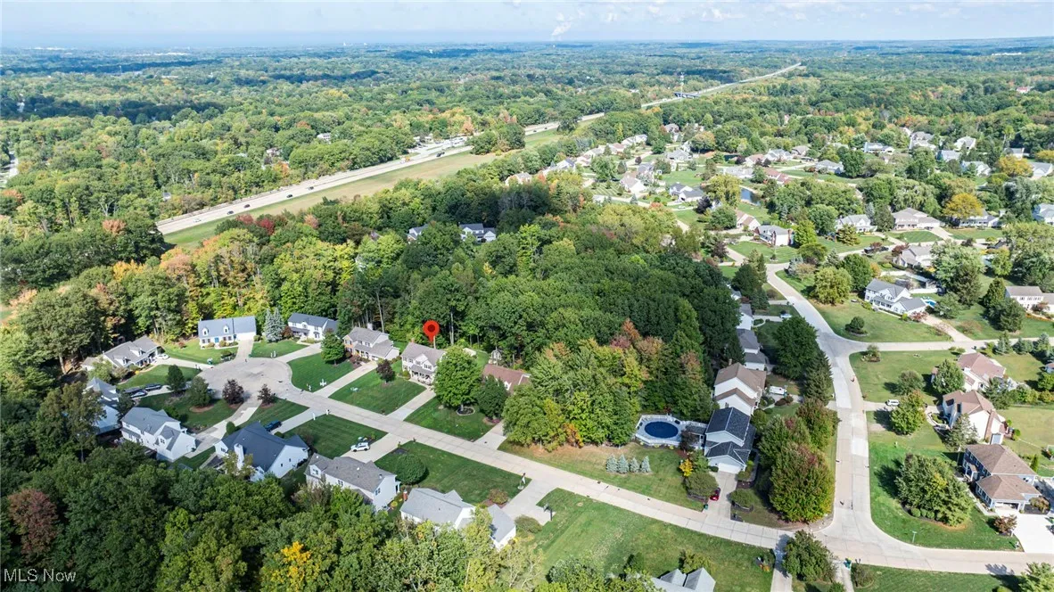 Aerial overview of property's location featuring nearby suburban area