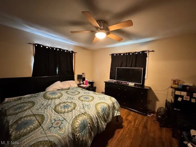 Bedroom featuring wood finished floors and ceiling fan