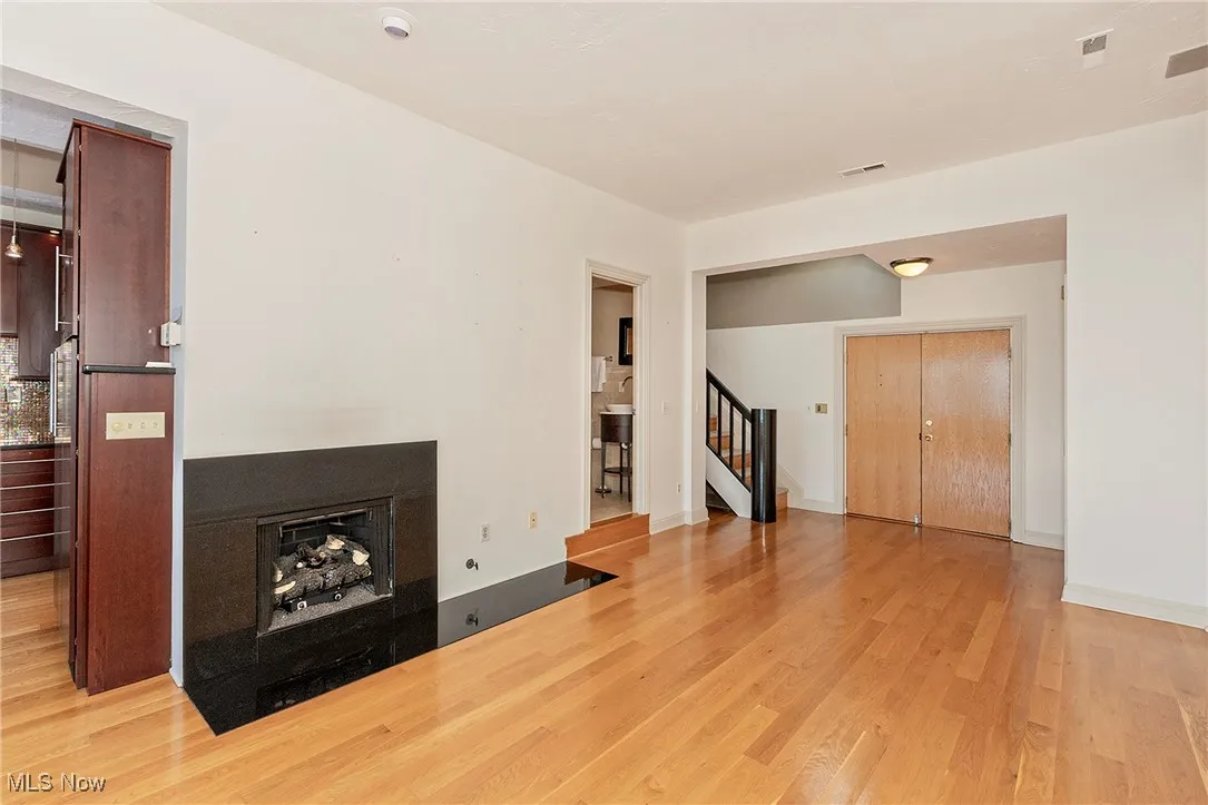 The main level and view of the double door entry and staircase to this special townhouse 2nd level