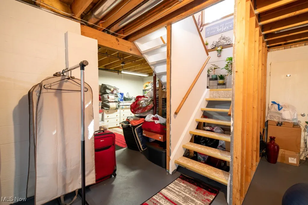 Unfinished basement area with stairs