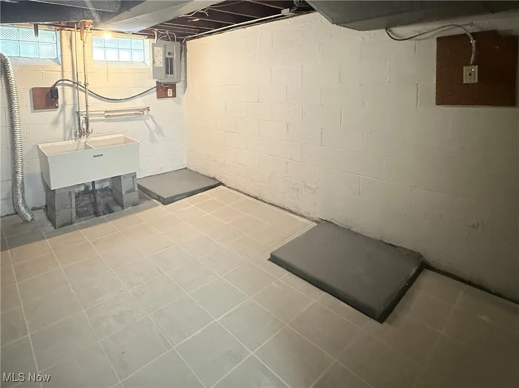 Basement featuring electric panel