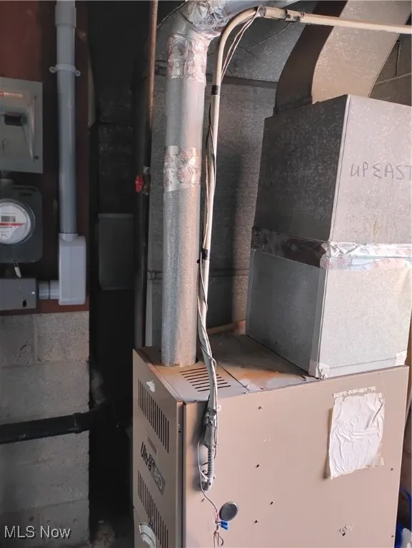 Utility room with heating unit and electric meter